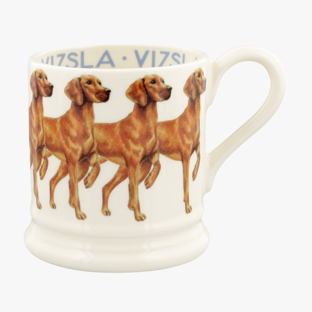 Emma Bridgewater Vizsla ceramic 1/2 Pint Coffee or Tea Mug - made from English earthenware and with the classic white finish, featuring the agile and alert Vizsla dogs showing its elegant pose hand printed onto the cream mug. Find the words 'Vizsla' across the inside of the mug any dog owner would love.